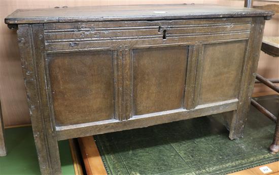 An early 18th century oak coffer, with panelled front, W.91cm